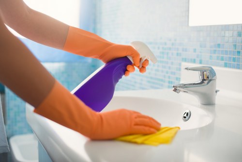 Removing stains from a sofa with a microfiber cloth