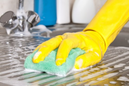 Technician performing deep upholstery cleaning on a couch